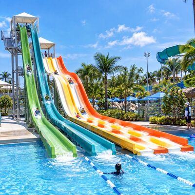qualità Scivolo d'acqua Rainbow Racer a più corsie in fibra di vetro per parco acquatico Fabbrica
